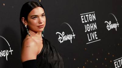 Dua Lipa reveals what she's thankful for, shares photos and video of "magical" Elton John concert appearance