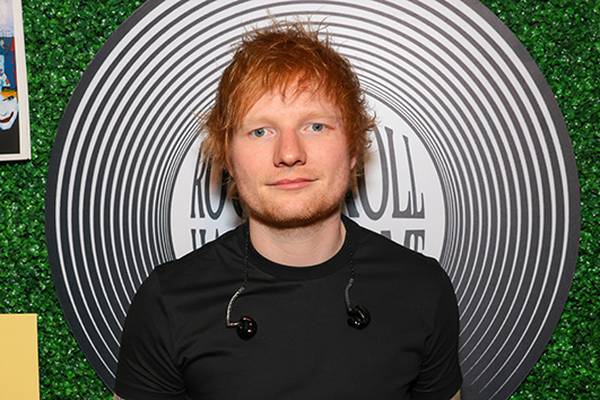 Ed Sheeran sneaks into his old high school to surprise students during award ceremony