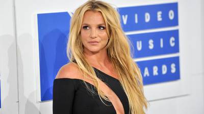 Britney Spears reveals she's dealing with a "small bug" similar to pregnancy nausea