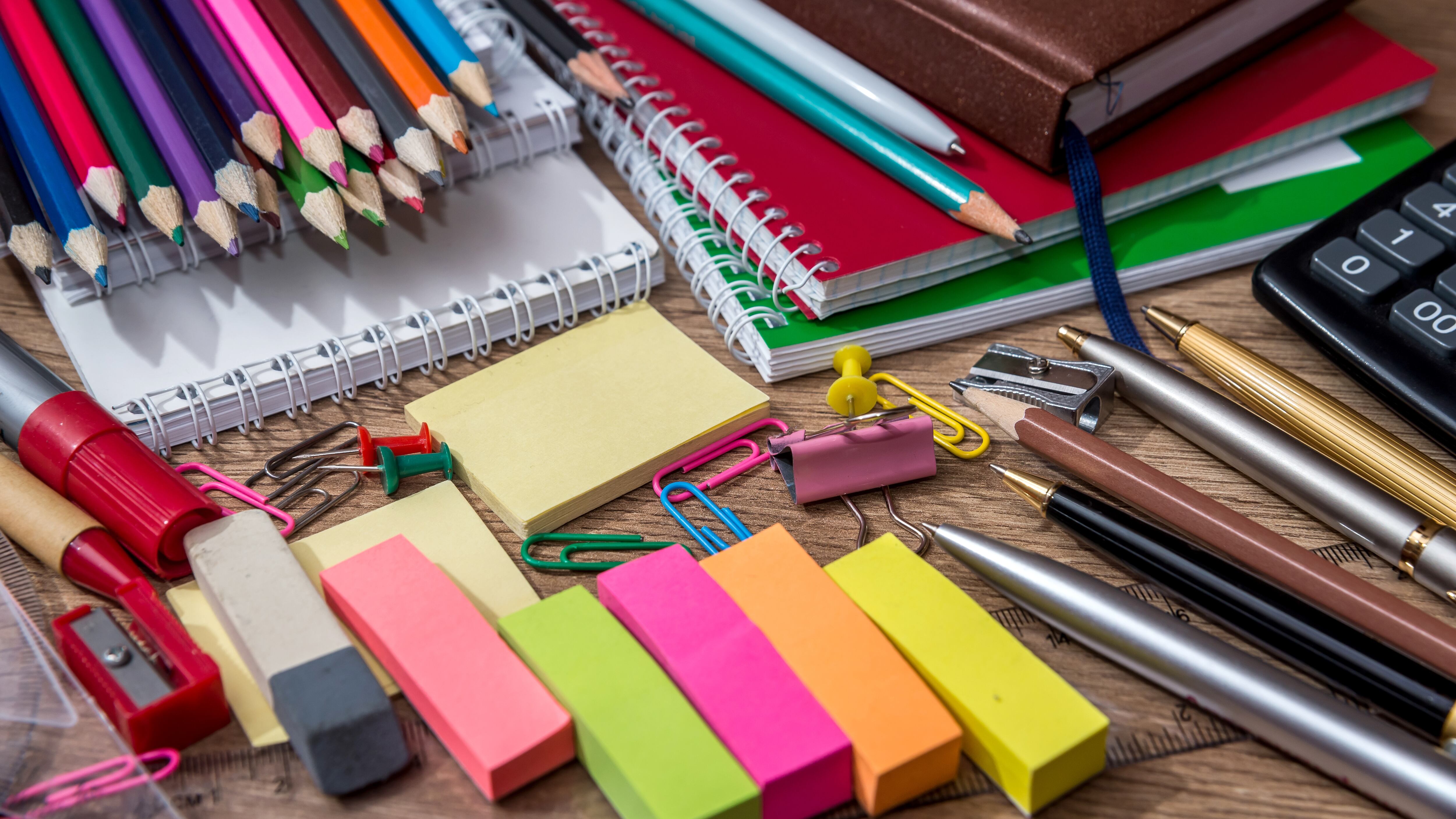 different school supplies on a wooden table