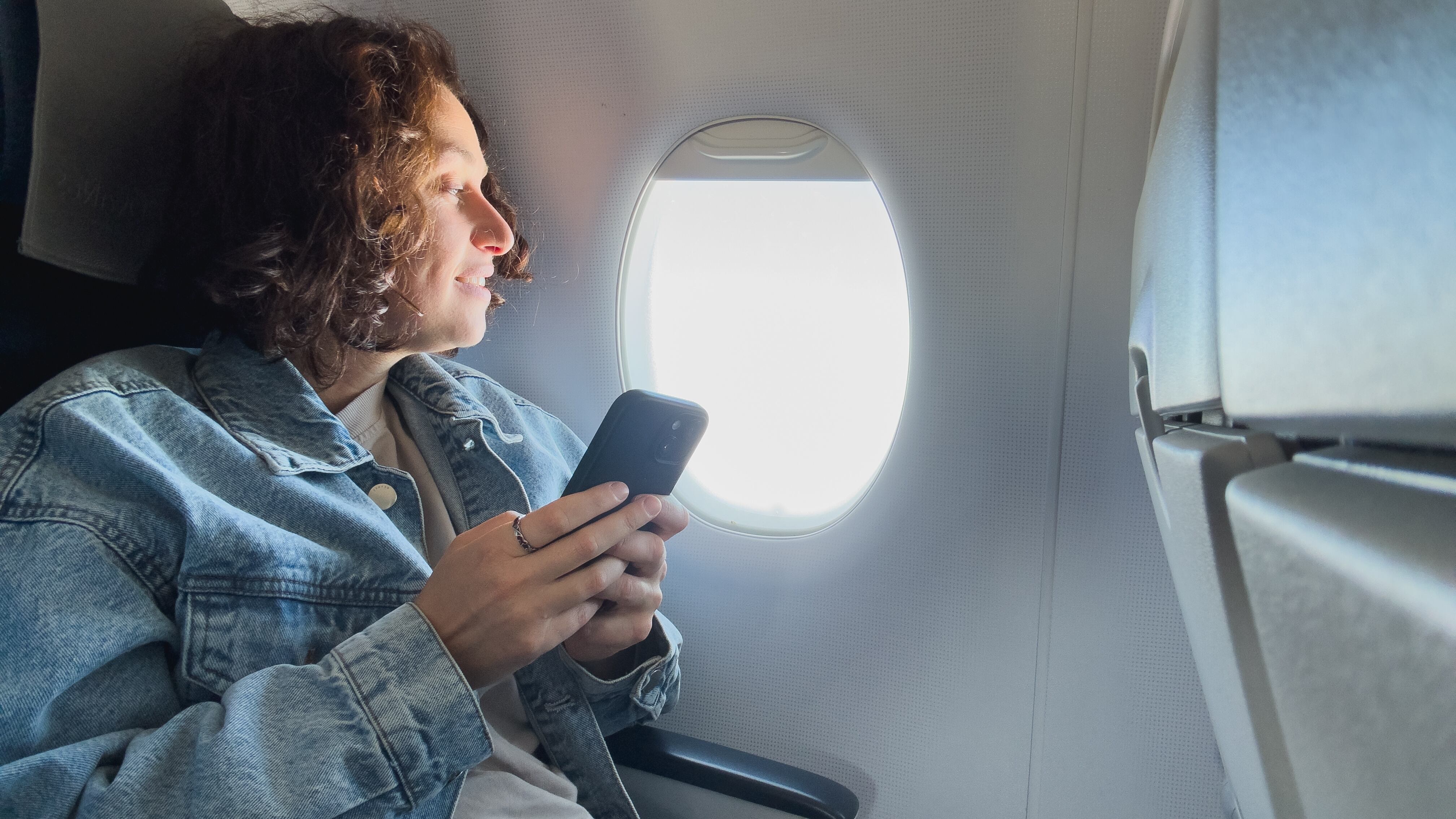 Woman using wifi connection on board.