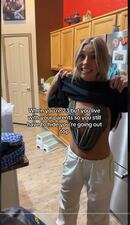 Tik-Toker @girlboss315 shows the audience her outfit that she is hiding from her parents just before she goes out to party with friends.