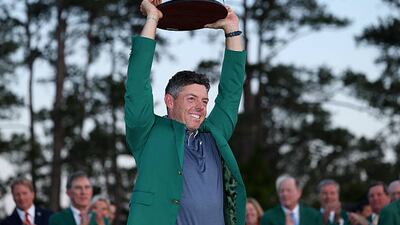 AUGUSTA, GEORGIA - APRIL 13: Rory McIlroy of Northern Ireland poses with the Masters trophy during the Green Jacket Ceremony after winning the 2025 Masters Tournament at Augusta National Golf Club on April 13, 2025 in Augusta, Georgia. (Photo by Richard Heathcote/Getty Images)